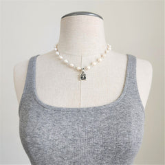 WHITE PEARL NECKLACE WITH FLEUR DE LIS PENDANT-17"