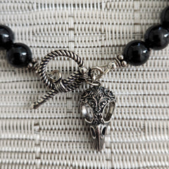 BLACK ONYX BRACELET WITH RAVEN CHARM