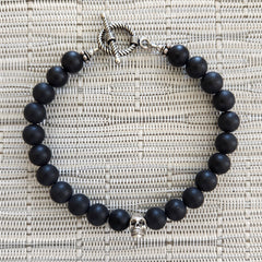 MATTE BLACK ONYX (8MM) BRACELET WITH SKULL BEAD