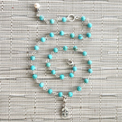 2--TURQUOISE NECKLACE WITH FLEUR DE LIS TAG