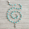 4--TURQUOISE NECKLACE WITH FLEUR DE LIS TAG