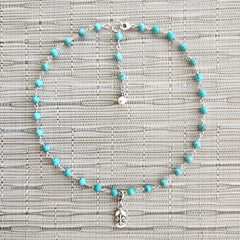 2--TURQUOISE NECKLACE WITH FLEUR DE LIS TAG