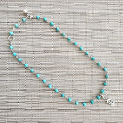 2--TURQUOISE NECKLACE WITH FLEUR DE LIS TAG