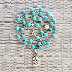 2--TURQUOISE NECKLACE WITH FLEUR DE LIS TAG