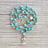 4--TURQUOISE NECKLACE WITH FLEUR DE LIS TAG