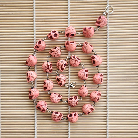 CORAL COLORED SKULL BEAD NECKLACE-28"