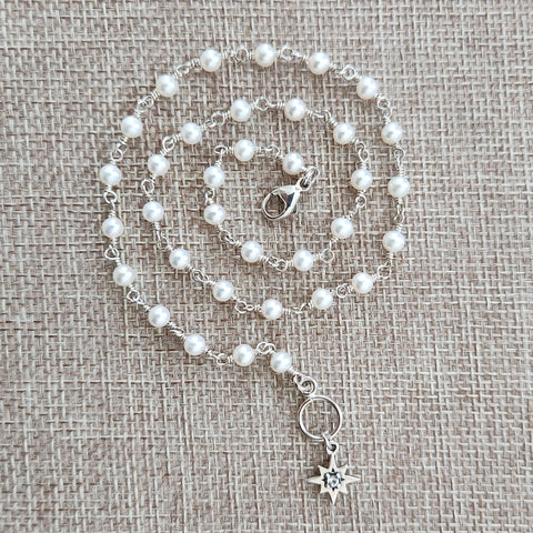 WHITE PEARL NECKLACE WITH 8 POINT STAR-16"