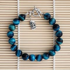 3--BLUE TIGERS EYE BRACELET W/ FLEUR DE LIS CHARM