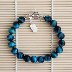 3--BLUE TIGERS EYE BRACELET W/ FLEUR DE LIS CHARM