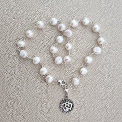 0--WHITE PEARL NECKLACE W/ OM PENDANT-16"