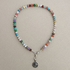 0--MIXED GEMSTONE NECKLACE IN JELLYBEAN COLORS W/ OM PENDANT-18"