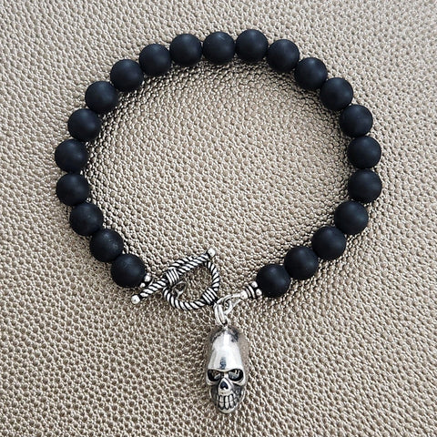 MATTE BLACK ONYX BRACELET W/ SKULL CHARM