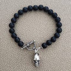 MATTE BLACK ONYX BRACELET W/ SKULL CHARM