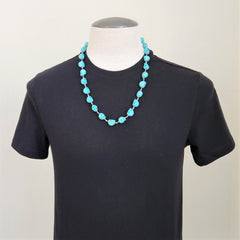 TURQUOISE COLORED SKULL BEAD NECKLACE-28"