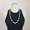 TURQUOISE COLORED SKULL BEAD NECKLACE-28"