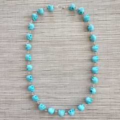 TURQUOISE COLORED SKULL BEAD NECKLACE-28"