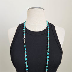 TURQUOISE COLORED SKULL BEAD NECKLACE-42 INCHES