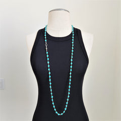 TURQUOISE COLORED SKULL BEAD NECKLACE-42 INCHES